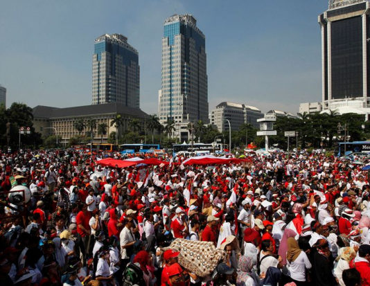 People take part in a rally against what they see as growing racial and religious intolerance in the world's largest Muslim-majority country, in Jakarta, Indonesia, November 19, 2016.