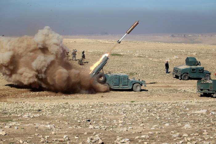 Members of the Iraqi rapid response forces fire a missile toward Islamic State militants during a battle in south of Mosul on Sunday.Reuters