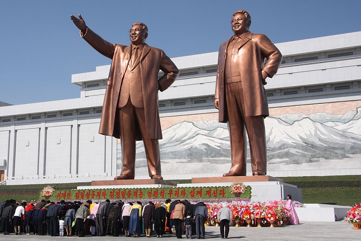 North Koreans bow to the statue of their late supreme leaders Kim Il-sung and Kim Jong-il