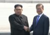 North Korean Supreme Leader Kim Jong-un and South Korean President Moon Jae-in shake hands at a historic summit.