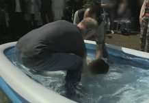 An Iranian convert to Christianity is baptised in the Netherlands, in a still from the BBC documentary 'Our World: Praying for Asylum'.