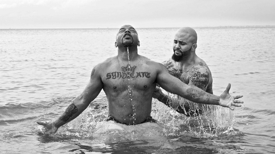 Rene "Level" Martinez baptizing his friend, Corey, who used to be in the gang Latin Syndicate with him.