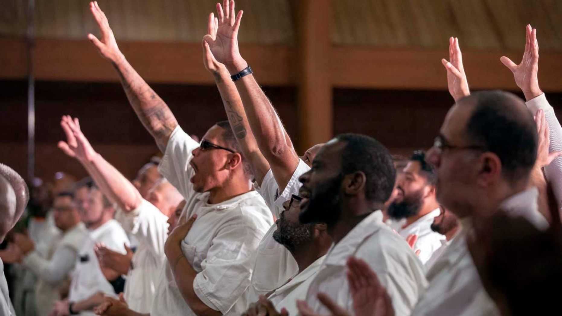 Inmates at the Coffield Unit, a maximum security prison in Anderson County, Texas, worship during a church service. They are part of the newest campus for Gateway Church of Dallas, Texas. (Gateway Church)