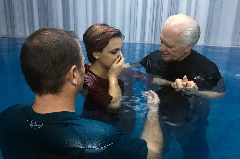 Pastors Karl Vickery and Rick Robinson baptize Iranian refugee Sabah Allahvardi, 22, in a Turkish bathhouse in Denizli.