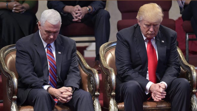 United States President Donald J. Trump with Vice President Mike Pence In Prayer