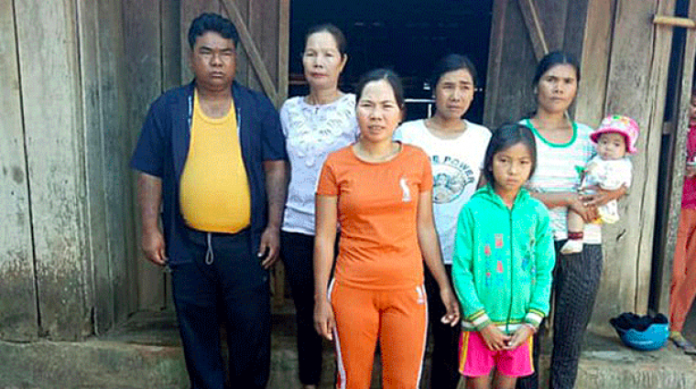 Y Ngun Knul (L) is shown with his wife and children after his release from prison in an undated photo. | Radio Free Asia