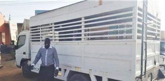 The Rev. Philemon Hassan Kharata with Baptist church truck confiscated in 2012.