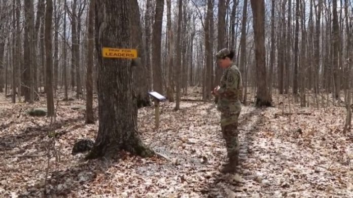 U.S. Army Chaplain Amy Smith prays while walking on the Spiritual Fitness Trail at Fort Drum in New York.