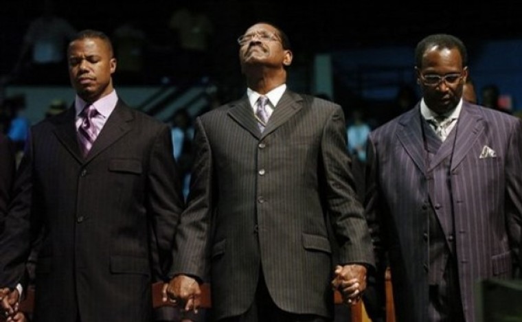Bishop Charles Blake (center) of Church of God in Christ and pastor of the West Angeles Church of God in Christ in Los Angeles, joins hands in prayer with Dr. Dwight Riddick (right), the senior pastor at Gethsemane Baptist Church in Newport News, Va., and Dr. William Curtis (left), senior pastor at Mt. Ararat Baptist Church in Pittsburgh, at the 94th Annual Hampton University Ministers Conference, June 3, 2008.