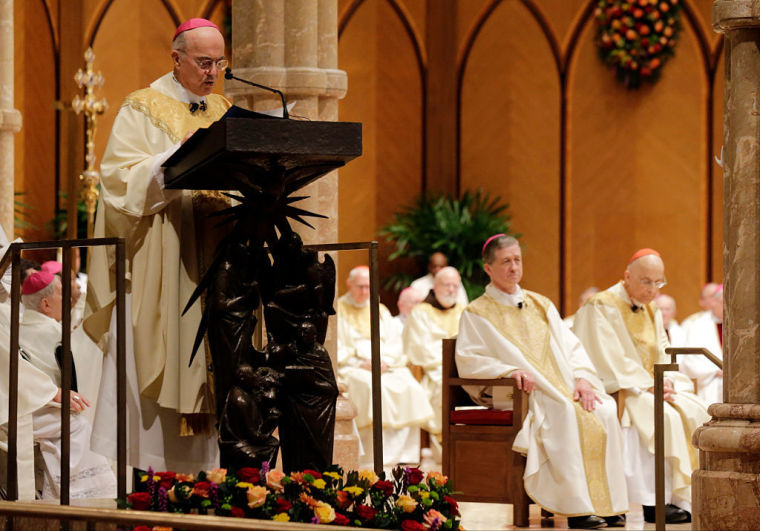 Archbishop Carlo Maria Viganò, Apostolic Nuncio of the United States, reads the Apostolic Mandate during the Installation Mass of Archbishop Blase Cupich at Holy Name Cathedral, November 18, 2014, in Chicago.